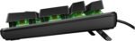 Low-profile mechanical keyboard with green switches visible under the keys and a wired connection on a built-in angled stand.