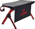 Gaming desk with red frame and RGB light bar, black laptop surface, headphones hung on side (G-MAX branding)