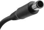 Close-up of a black DC power plug with a silver cylindrical tip and attached cable, used to supply power to devices