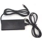 Laptop power adapter with detachable power cord and plug prongs on a white background