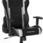 Black and silver DXRacer Prince gaming chair with high back, side bolsters, and wheeled base.
