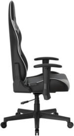 Side view of a black ergonomic office chair with padded seat and back, gray trim, and a five-wheel base for mobility.