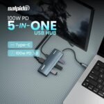 5‑in‑1 USB-C hub connected to a laptop, highlighting 100W PD 3.0 and Type‑C labels on a blue hub.