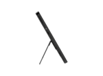 Side view of a black graphics tablet on an adjustable stand against a black background.