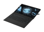 Open black laptop in tent mode with a blue holographic globe and futuristic HUD on the screen