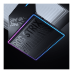 Gaming laptop with blue and purple RGB edge lighting shown at a dynamic tilted angle, emphasizing its sleek, modern design.