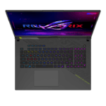 Top-down view of a dark gaming laptop with rainbow RGB keyboard lighting and a neon ROG screen