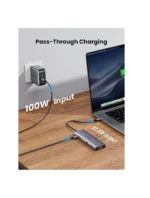 Pass-through charging setup showing a USB-C hub connected to a wall outlet and a laptop, labeled 100W input and 96.5W output. | Ahoundjuè Technologies Pass-through charging setup showing a USB-C hub connected to a wall outlet and a laptop, labeled 100W input and 96.5W output.