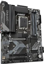 Black Gigabyte gaming motherboard with LGA socket, four memory slots, PCIe slot, and large heatsinks labeled 'GIGABYTE' and 'i GAMEING' (gaming branding).