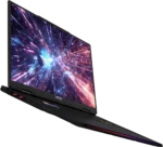 MSI gaming laptop open at an angle, screen showing a colorful space/nebula wallpaper