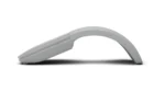 Curved gray handheld device resting on a white surface with a soft shadow, shown in profile.