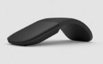 Black wireless ergonomic mouse with a curved, hinge-like design on a light gray background for comfort-focused use imagery.