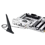 White motherboard with PCIe slots and rear I/O panel, connected to a small external Wi‑Fi antenna on a stand. | Ahoundjuè Technologies White motherboard with PCIe slots and rear I/O panel, connected to a small external Wi‑Fi antenna on a stand.