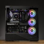 Open PC case showing a GeForce RTX graphics card, circular RGB CPU cooler, braided hoses, and three RGB intake fans.