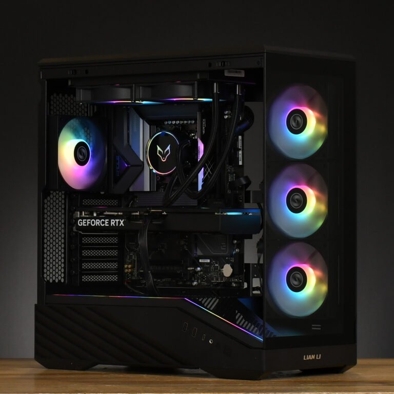 Black mid‑tower gaming PC with a transparent side panel, RGB airflow fans, and a GeForce RTX graphics card visible inside.