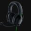 Black over-ear gaming headset with attached mic on a dark background, wired with a green accent cable (Razer branding). Popular for immersive audio.