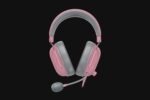 Pink over-ear headset with gray ear cushions and a microphone on a black background
