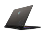 Open gaming laptop at a slight angle showing a glowing RGB keyboard and a stylized circuit design on the lid (MSI-style logo).