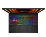 Top-down view of a black gaming laptop with a rainbow RGB backlit keyboard and glowing lid design on a dark background.
