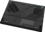 Back view of a dark rugged gaming laptop with prominent GIGABYTE branding and large rear vents/grille design for cooling.