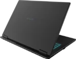 Laptop viewed from the side, lid closed halfway, with a glowing teal backlit keyboard visible on the right side and a Gigabyte logo on the lid.