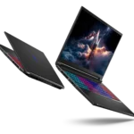 Black gaming laptop with a multi-color RGB keyboard and a space-themed wallpaper on the screen