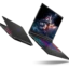 Black gaming laptop with a multi-color RGB keyboard and a space-themed wallpaper on the screen
