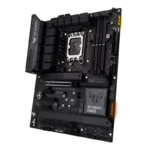 Gaming motherboard laying flat with CPU socket, RAM slots, PCIe slots, and heatsinks visible; TUF GAMING branding evident on the board.