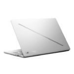 Silver laptop angled with lid partially open, showing left-side ports and a diagonal vent stripe on the lid | Ahoundjuè Technologies Silver laptop angled with lid partially open, showing left-side ports and a diagonal vent stripe on the lid