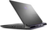 Angled view of a dark gaming laptop with purple accents, showing side ports and air vents.