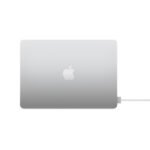 Closed silver MacBook laptop with a white Apple logo on the lid, facing front-left, gradient aluminum finish